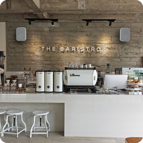 Bluesound Pro BSP 500 speakers in a cafe