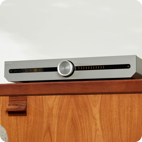 Roksan amplifier on a media console table